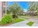 A street lined with trees and homes featuring well-maintained lawns and sidewalks at 212 Greenwich Dr., Conway, SC 29526