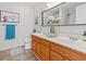 Well-lit bathroom features a double sink vanity with a framed mirror and a shower behind a glass door at 212 Sweetbay Magnolia St., Loris, SC 29569