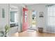 Inviting entryway featuring wood floors and an open view to the adjacent bedroom at 212 Sweetbay Magnolia St., Loris, SC 29569