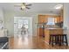Open kitchen area featuring a breakfast bar that seamlessly flows into the adjacent dining space at 212 Sweetbay Magnolia St., Loris, SC 29569