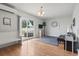 Bright living room features hard wood floors, an AC unit, and large sliding glass doors at 212 Sweetbay Magnolia St., Loris, SC 29569