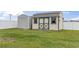 Outdoor storage sheds on green grass in the backyard at 212 Sweetbay Magnolia St., Loris, SC 29569