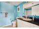 Bathroom featuring bright blue walls, white fixtures, and a granite countertop at 2151 Bridge Ct. # 1-305, North Myrtle Beach, SC 29582