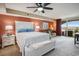 Bedroom displays a large bed, seating area, and access to a private balcony at 2151 Bridge Ct. # 1-305, North Myrtle Beach, SC 29582