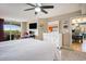 Bedroom showcasing a large bed, dresser, tv, and balcony access at 2151 Bridge Ct. # 1-305, North Myrtle Beach, SC 29582