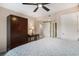 Bedroom featuring a large bed, ceiling fan, and dark wood furniture at 2151 Bridge Ct. # 1-305, North Myrtle Beach, SC 29582