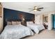 Bedroom displaying two beds, a ceiling fan, and a blue accent wall with nautical decor at 2151 Bridge Ct. # 1-305, North Myrtle Beach, SC 29582