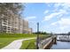 Waterfront property with lush lawn alongside boardwalk and boat docking area at 2151 Bridge Ct. # 1-305, North Myrtle Beach, SC 29582