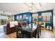 Dining room showcasing modern lighting, artwork and balcony access at 2151 Bridge Ct. # 1-305, North Myrtle Beach, SC 29582