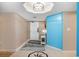 Condo foyer with tile flooring, white door and blue wall with light fixture at 2151 Bridge Ct. # 1-305, North Myrtle Beach, SC 29582