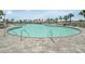 Inviting community pool with accessible entry and poolside bar, surrounded by lush palm trees and well-maintained pavers at 2151 Bridge Ct. # 1-305, North Myrtle Beach, SC 29582