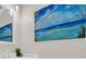 Bathroom features a stylish painting, mirror, white walls, and a sleek sink at 217 N Myrtle St. # 1, Myrtle Beach, SC 29577