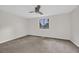 Bright and airy bedroom with neutral walls, carpeted floors, fan and a window at 217 N Myrtle St. # 1, Myrtle Beach, SC 29577