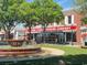 Grand Strand Brewing Company featuring outdoor seating, a fountain, and verdant trees on a sunny day at 217 N Myrtle St. # 1, Myrtle Beach, SC 29577