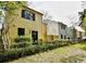 Charming exterior view of townhomes with black shutters and well-kept lawns at 217 N Myrtle St. # 1, Myrtle Beach, SC 29577