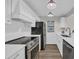 Modern kitchen features stainless steel appliances, white cabinets, and quartz countertops at 217 N Myrtle St. # 1, Myrtle Beach, SC 29577