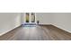 Open living room with hardwood floors and glass doors to the patio at 217 N Myrtle St. # 1, Myrtle Beach, SC 29577