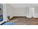 Empty living room with hardwood floors and a view of the entryway and bathroom at 217 N Myrtle St. # 1, Myrtle Beach, SC 29577