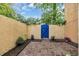 Charming brick patio with colorful flowers and a vibrant blue gate at 217 N Myrtle St. # 1, Myrtle Beach, SC 29577