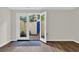 Bright living room showcasing hardwood floors and direct access to a private patio at 217 N Myrtle St. # 1, Myrtle Beach, SC 29577
