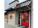 Swig & Swine restaurant featuring bright red doors, a cozy exterior, and ample parking at 217 N Myrtle St. # 1, Myrtle Beach, SC 29577