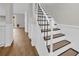 Beautiful staircase with white risers, and black metal railing at 217 N Myrtle St. # 1, Myrtle Beach, SC 29577