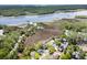 Expansive aerial view of community and adjacent waterway, offering serene natural beauty at 2191 Liberty Circle, Little River, SC 29566