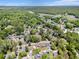 Expansive aerial view of a neighborhood nestled among lush green trees and foliage at 2191 Liberty Circle, Little River, SC 29566