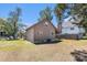 View of back of house with a small porch and yard at 2191 Liberty Circle, Little River, SC 29566