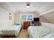 Upstairs bedroom with two twin beds, window and TV on the wall at 2191 Liberty Circle, Little River, SC 29566