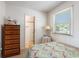 Bright bedroom with a patterned comforter and a private bathroom at 2191 Liberty Circle, Little River, SC 29566