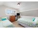 Bright bedroom features two twin beds and a sunny window at 2191 Liberty Circle, Little River, SC 29566