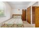 Bedroom with a patterned comforter and access to an additional closet at 2191 Liberty Circle, Little River, SC 29566