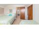Upstairs bedroom with two twin beds, closet space, and adjoining room at 2191 Liberty Circle, Little River, SC 29566