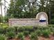 Entrance sign for Windjammer Village featuring brick, stone, and nautical themed accents at 2191 Liberty Circle, Little River, SC 29566