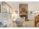 Bright dining area with a cozy fireplace and large windows at 2191 Liberty Circle, Little River, SC 29566