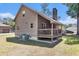 Back exterior showing a porch and an air conditioning unit at 2191 Liberty Circle, Little River, SC 29566