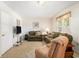 Comfortable living room area with plush seating, carpet flooring, and lots of natural light at 2191 Liberty Circle, Little River, SC 29566