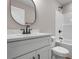 Modern bathroom with white vanity, black hardware, and shower-tub combination at 2260 Pearl Rd., Galivants Ferry, SC 29544