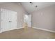 Bedroom featuring plush carpet, neutral walls, ceiling fan, closet, and doorway to hallway at 2260 Pearl Rd., Galivants Ferry, SC 29544