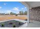 Charming home with brick exterior and manicured front yard featuring new landscaping, ready for spring planting at 2260 Pearl Rd., Galivants Ferry, SC 29544