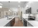 A modern kitchen featuring a large island, stainless steel appliances, and hardwood flooring at 2260 Pearl Rd., Galivants Ferry, SC 29544