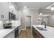 Beautiful modern kitchen with white cabinets, quartz counters, and stainless steel appliances at 2260 Pearl Rd., Galivants Ferry, SC 29544