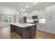 A modern kitchen featuring a large island, stainless steel appliances, and hardwood flooring at 2260 Pearl Rd., Galivants Ferry, SC 29544