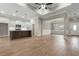Open floor plan with living, dining, and kitchen area featuring wood floors and neutral paint at 2260 Pearl Rd., Galivants Ferry, SC 29544