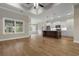Open floor plan featuring wood floors, a kitchen island with bar seating, and lots of natural light at 2260 Pearl Rd., Galivants Ferry, SC 29544