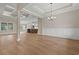 An open-concept living and dining space featuring wood floors and natural light at 2260 Pearl Rd., Galivants Ferry, SC 29544