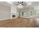 Spacious living room featuring a fireplace, tray ceiling, recessed lighting, and wood flooring at 2260 Pearl Rd., Galivants Ferry, SC 29544