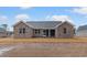 New construction features a brick exterior and a screened-in porch, with an expansive back yard at 2260 Pearl Rd., Galivants Ferry, SC 29544
