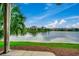 Inviting backyard overlooking the serene water, surrounded by lush landscaping and mature trees at 24 Frigate Ct., Pawleys Island, SC 29585